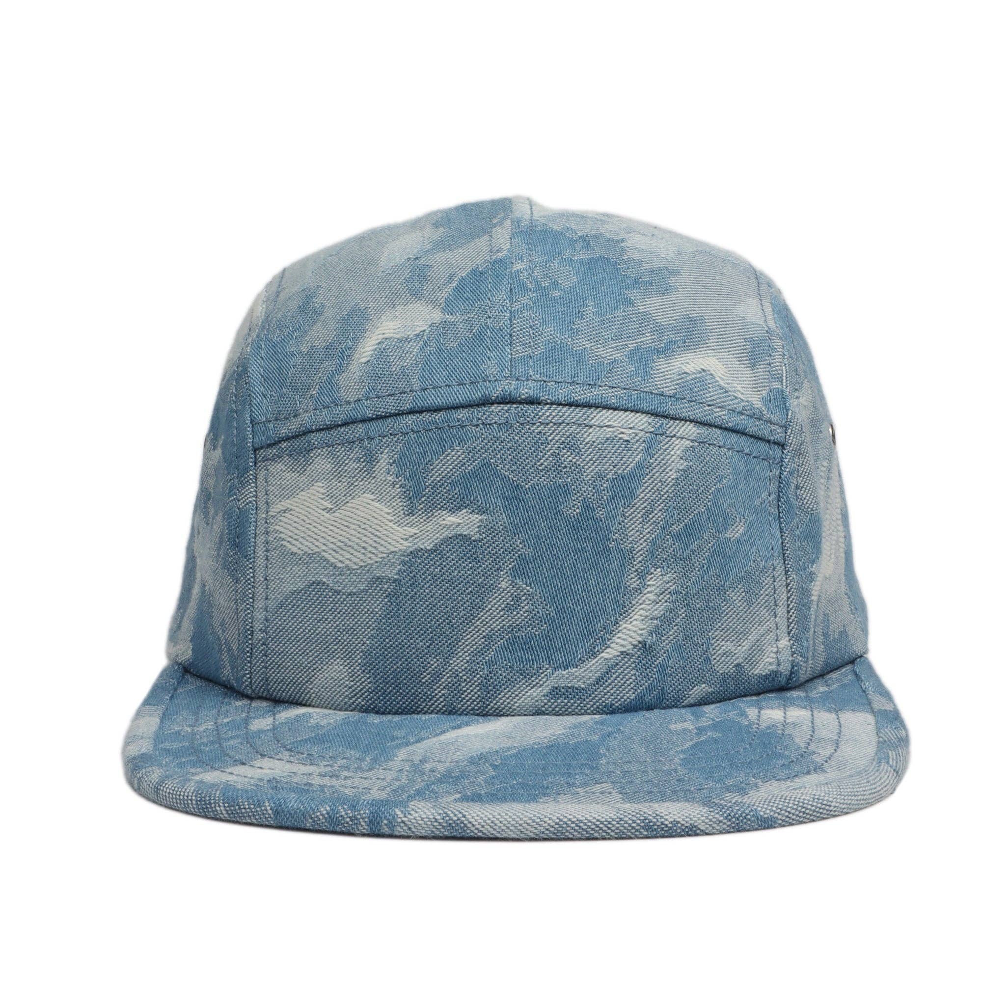 A five panel light denim hat with cloud like pattern 